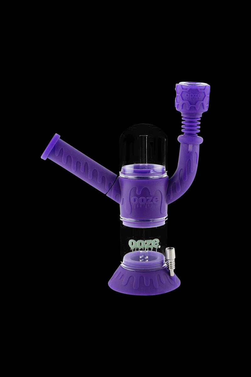 Front view of the Ooze “Cranium” Silicone 4-in-1 Glass Water Pipe, showcasing its purple glass construction and unique, rounded shape.