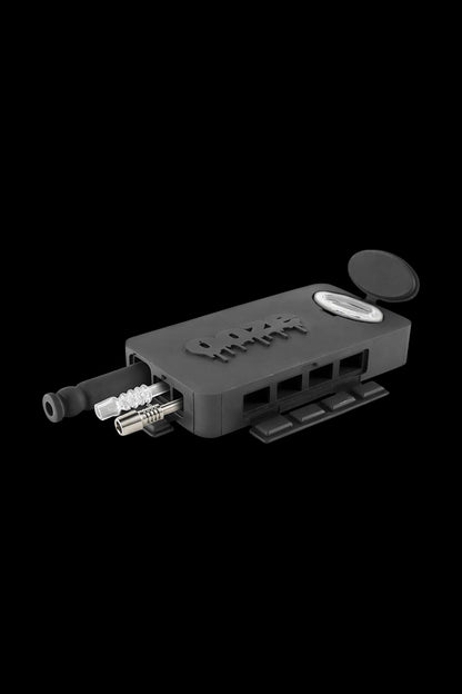 A close-up shows the Ooze Slugger Dabbin Dugout, with a dark gray exterior and visible tool attachments.