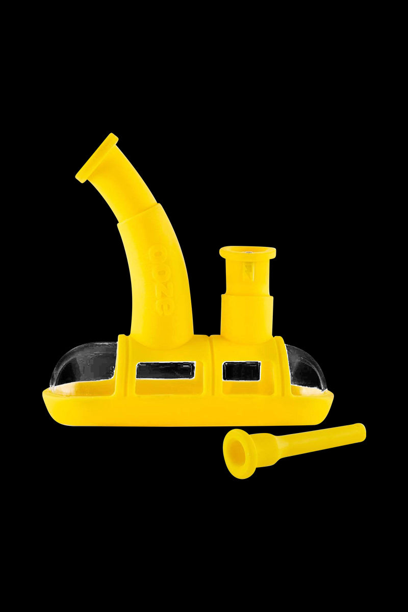 A side view of the Ooze Steamboat Silicone Bubbler Boat Bong, displaying its boat-shaped design and translucent material.