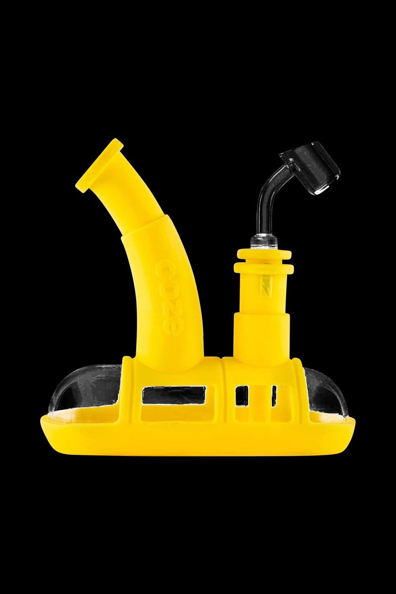 A front view of the Ooze Steamboat Silicone Bubbler Boat Bong, displaying its boat-shaped design in a bright yellow hue.