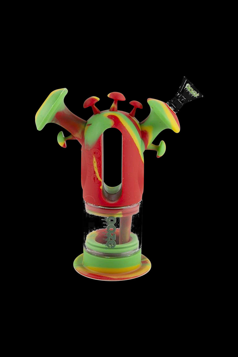 A front view of the Ooze "Trip" Silicone Bubbler, showcasing its colorful, rounded design against a dark background.