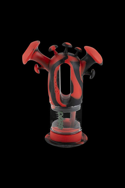 A front view of the Ooze “Trip” Silicone Bubbler, showcasing the vibrant red, textured design against a dark background.