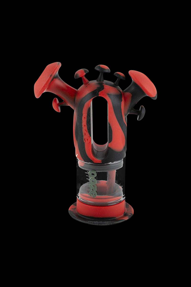 A front view of the Ooze “Trip” Silicone Bubbler, showcasing the vibrant red, textured design against a dark background.