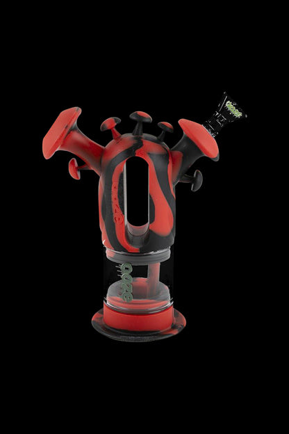 Front view of the Ooze "Trip" Silicone Bubbler, showcasing its vibrant red, rounded form against a dark background.