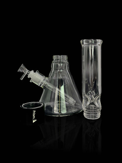 A studio shot features the Prism Water Pipes Starter Kit, highlighting the clear glass pipe angled against a dark backdrop.