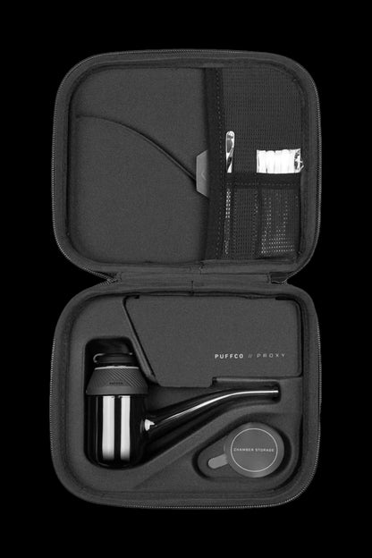 Black carrying case open, displaying a Puffco Proxy cannabis vaporizer and accessories.