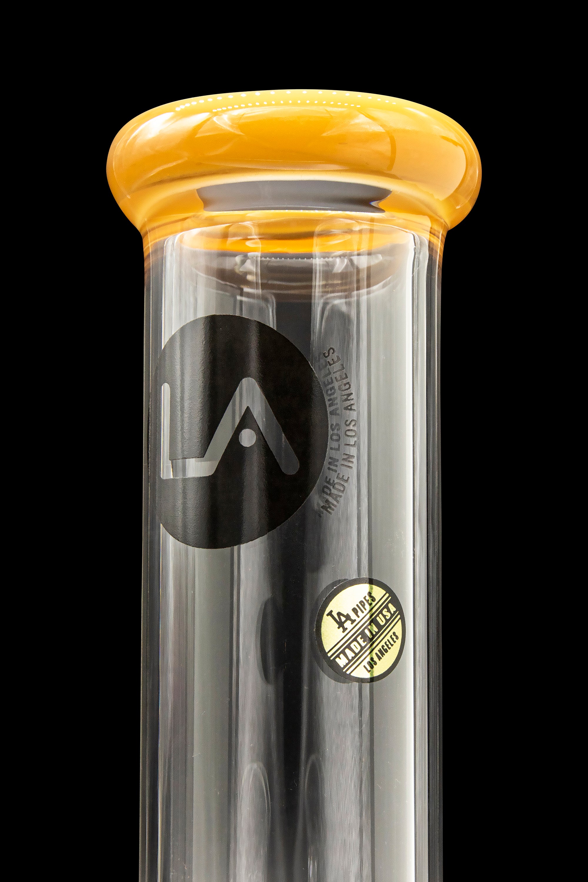 A sleek, black glass water pipe with a rounded amber mouthpiece, branded with a stylized "LA" logo and "Made in USA".