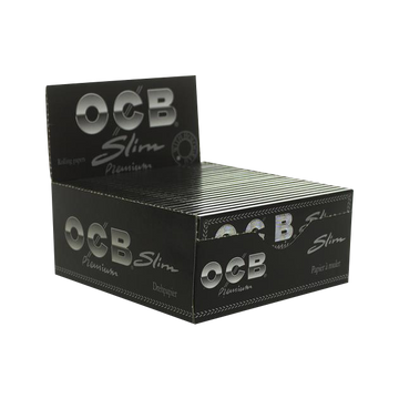 A slightly angled, close-up view of OCB Premium Single Wide Rolling Papers, showing the branded packet against a neutral background. - OCB Premium Single Wide Rolling Papers