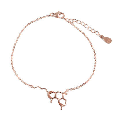 A close-up of the Smoke Cartel THC Molecule Bracelet, a delicate silver chain featuring a molecular pendant.