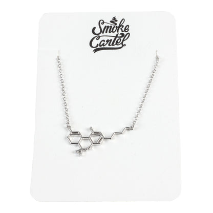 A close-up shot of the Smoke Cartel THC Molecule Necklace, a delicate silver chain featuring a molecular pendant.