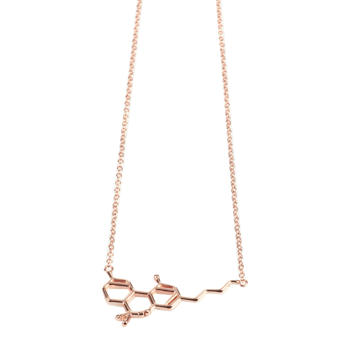 A close-up, angled view of the Smoke Cartel THC Molecule Necklace, featuring a delicate, silver-toned pendant.