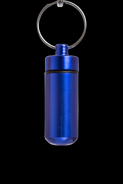 A front view of the Discrete Key Chain Stash Jar, a small, blue metal container with a key ring attached.