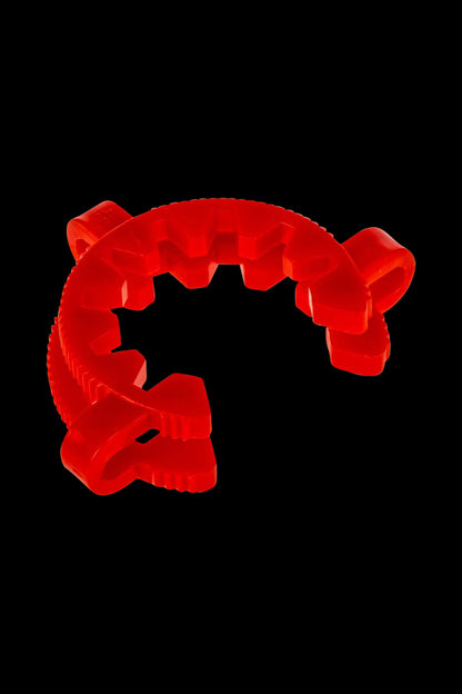 A close-up shot of the Acrylic Keck Clip - 50mm, showcasing its transparent design against a plain black background.