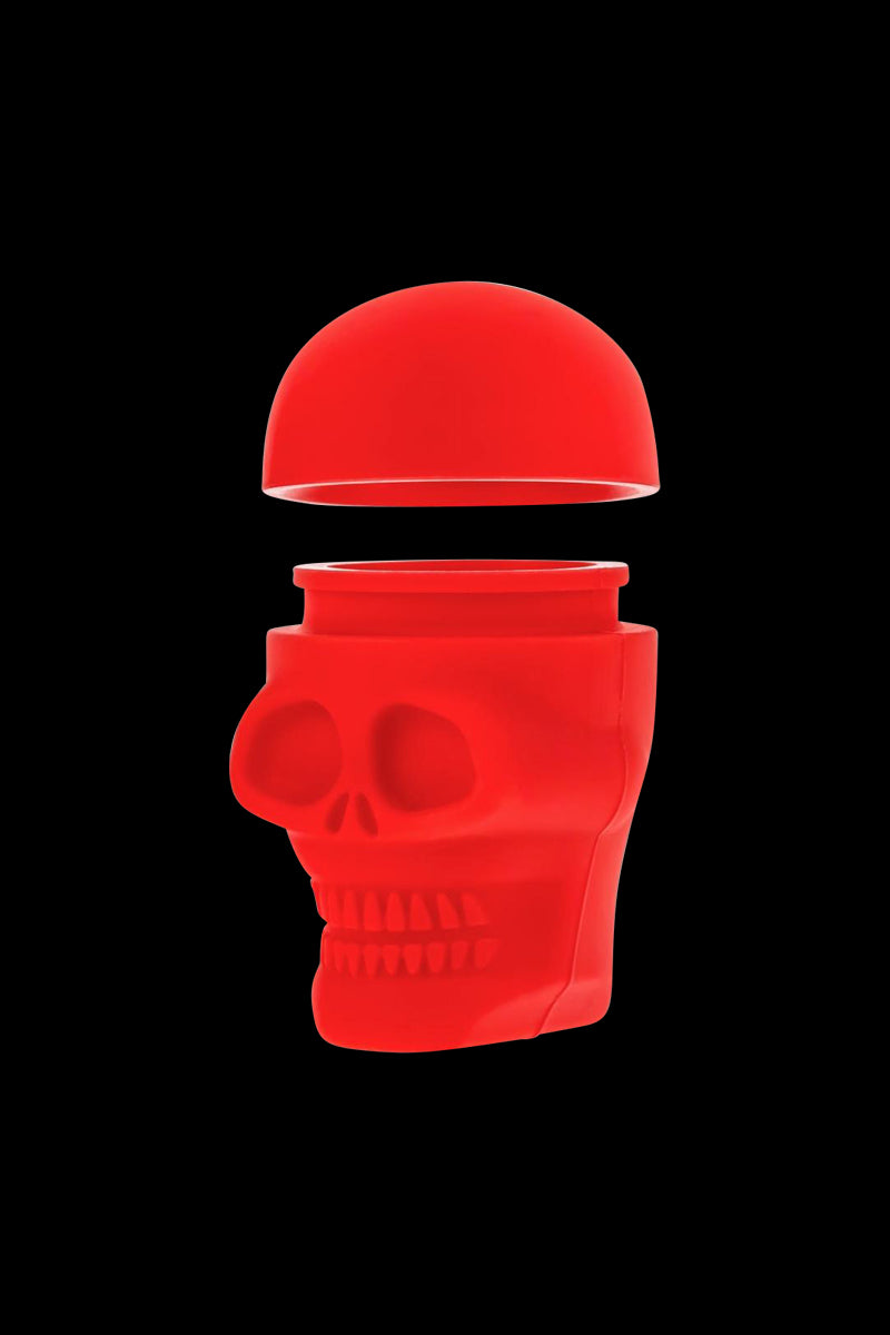 A slightly angled view of the Silicone Non-Stick "Skull" Stash Container, featuring a detailed skull design in a solid color.