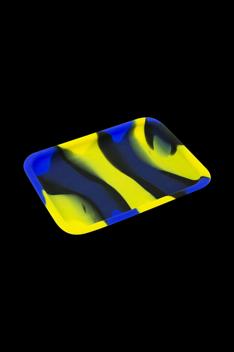 A top-down view of the Silicone Concentrate Tray, showcasing its smooth, dark surface against a black background.