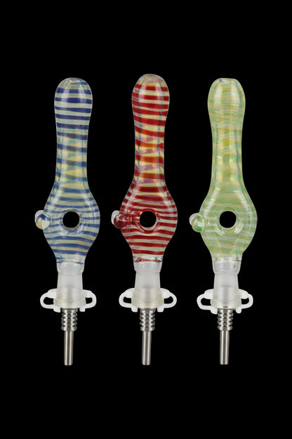Colorful glass dab tools with patterned handles and titanium tips.