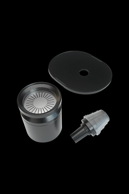 Black cannabis vaporizer components disassembled, including a bowl, lid, and mouthpiece.