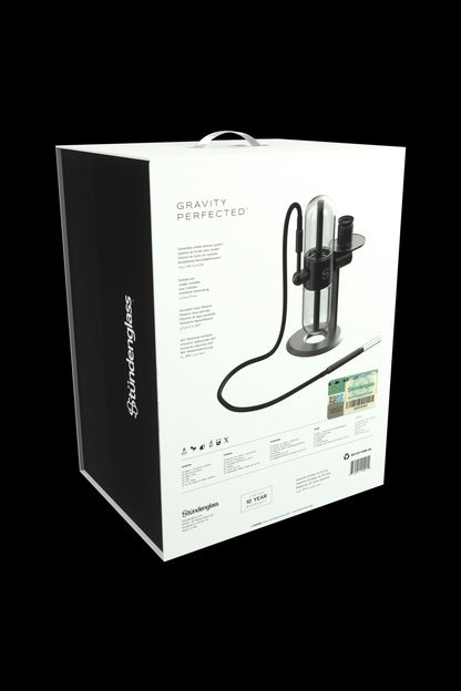 Stündenglass Gravity Hookah packaging displaying a clear glass bubbler with a suspension system and silicone hose.