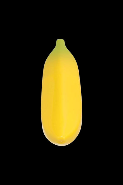 Center-frontal view of the Metal Hand Pipe with Silicone Banana Skin against a solid black background, showing its smooth yellow banana-shaped silicone cover.