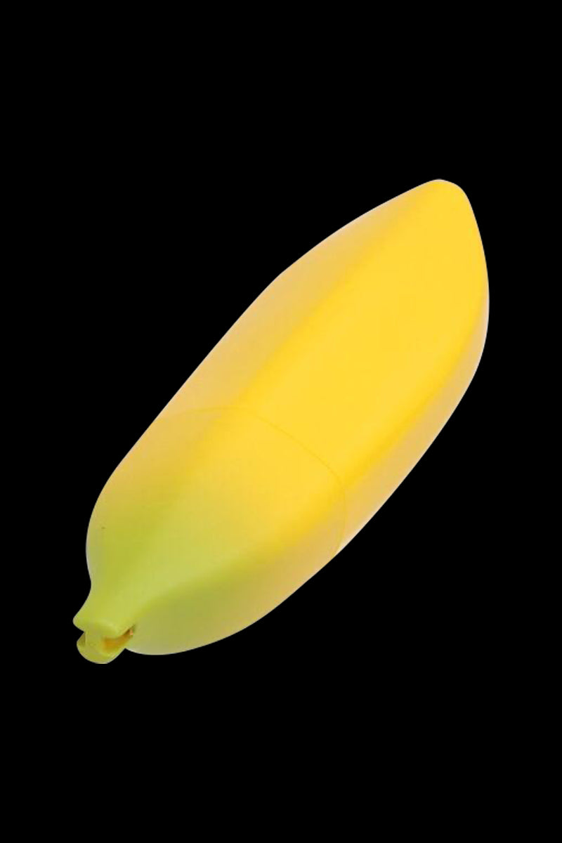 Diagonal close-up of a yellow silicone Metal Hand Pipe with Silicone Banana Skin against a black background, showing its tapered tip and matte texture